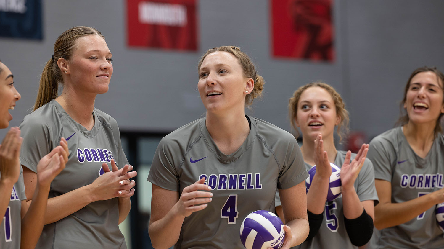Helaina Hillyard and her teammates preparing to play volleyball.